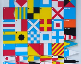 May include: A collection of square and triangular tiles featuring international maritime signal flags, each labeled with letters A through Z, numbers 0 through 9, and special markers including Finish, Start, Black, AP, S1, S2, and S3 in vibrant colors.
