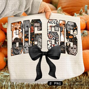 May include: A cream-colored sweatshirt with the words "BIG SIS" in a block letter design. Each letter is filled with a different Halloween-themed graphic, including horror movie characters and floral patterns. A large black bow is attached at the bottom.