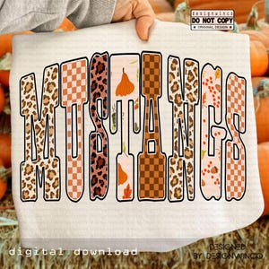 May include: A white t-shirt with the word "MUSTANGS" in a retro font. The letters feature various patterns, including leopard print, checkered, and fall-themed designs. The words "digital download" are at the bottom.