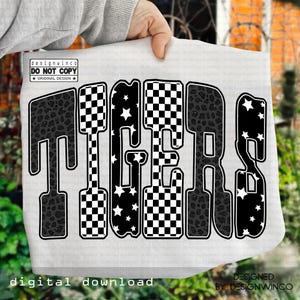 May include: A white digital download featuring the word "TIGERS" in a bold, outlined font. The letters are filled with a mix of black and white checkered patterns, star patterns, and leopard print. The design includes the text "DESIGNED BY DESIGNWINCO".