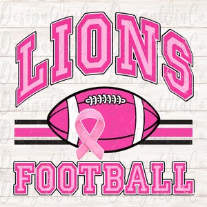 May include: A graphic design featuring the word LIONS in pink varsity-style letters above a pink football with white stripes and a pink awareness ribbon. The word FOOTBALL appears below in matching pink letters, all set against a light wood background.
