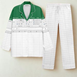 May include: A two-piece pajama set. The top is green with white trim and a white Excel spreadsheet design. The pants are white with a gray grid pattern. The pajama top has buttons down the front.