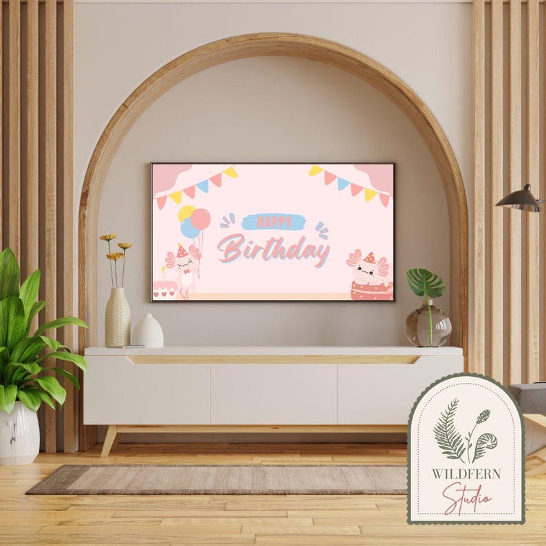 May include: A pink and blue birthday banner with the text "Happy Birthday" and illustrations of axolotls. The banner is displayed on a television screen in a living room setting.