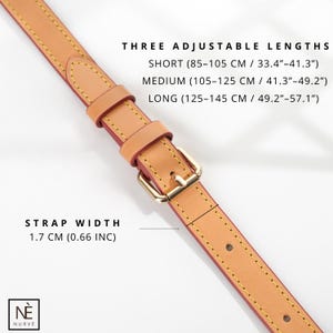 Pode incluir: Uma tira de couro bege com costuras amarelas e uma fivela de metal dourado. A tira &eacute; ajust&aacute;vel em tr&ecirc;s comprimentos: curto (85-105 cm), m&eacute;dio (105-125 cm) e longo (125-145 cm). A tira tem 1,7 cm (0,66 polegadas) de largura.