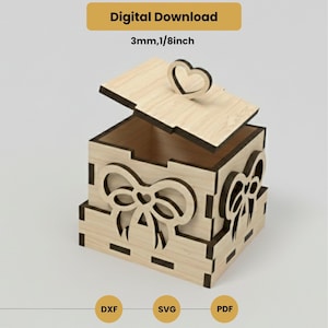 May include: A light-coloured wooden box with a heart-shaped handle on the lid. The box features bow-shaped cutouts on the sides. The text "Digital Download" and "3mm, 3.18mm" are visible. The bottom of the image shows the file types: DXF, SVG, and PDF.