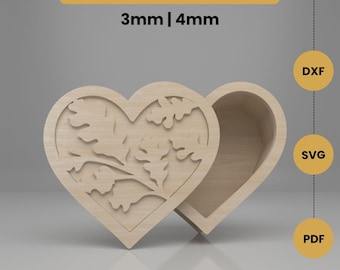 May include: A wooden heart-shaped box with a decorative cutout design on the lid. The box is open, revealing the interior. Text on the image reads "DIGITAL DOWNLOAD" and "3mm | 4mm". The image also includes "DXF", "SVG", and "PDF" labels.
