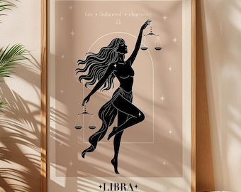 May include: A framed Libra zodiac art print. The artwork features a black silhouette of a woman holding scales, with the word "LIBRA" below. The background is a soft beige with the words "fair, balanced, charming" above the figure.