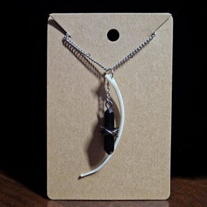 Blood Python rib bone necklace with faux crystal charm pendant