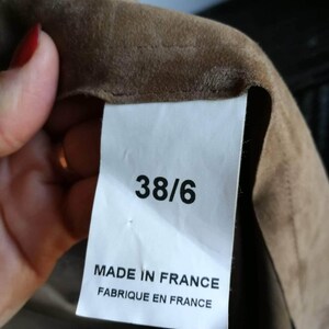 May include: A white tag with black text that reads "38/6 Made in France Fabrique en France".