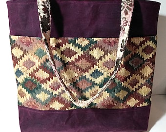 Berry waxed canvas tote bag with tapestry pockets and handles and magnetic snap