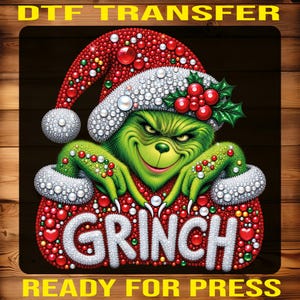 May include: A DTF transfer featuring a green character wearing a Santa hat and white fur trim, decorated with red, white, and green beads. The word GRINCH is displayed in white letters. The text DTF TRANSFER and READY FOR PRESS is included.