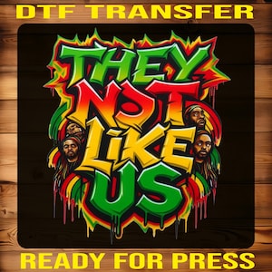 May include: DTF transfer with the text "THEY NOT LIKE US" in green, red, and yellow graffiti style. The design includes portraits of three men and the words "READY FOR PRESS" in yellow.