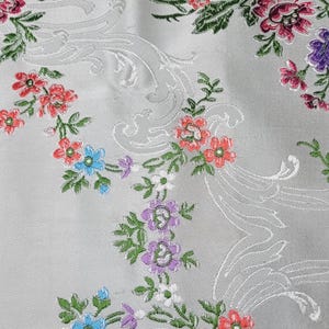 May include: A set of three ceramic mugs with a speckled, matte finish. The mugs are in shades of cream, light gray, and dark gray. Each mug has a simple, minimalist design, perfect for coffee or tea.