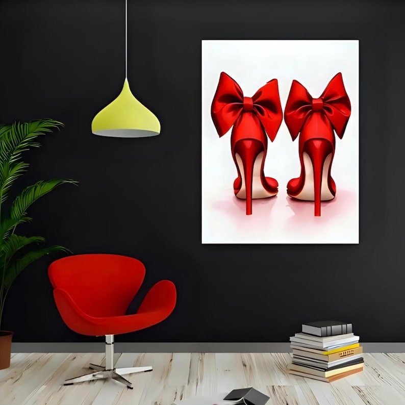May include: A framed print featuring two red high-heeled shoes with large bow accents. The shoes are set against a white background, with a glossy finish. The heels are slender and the overall design is elegant.