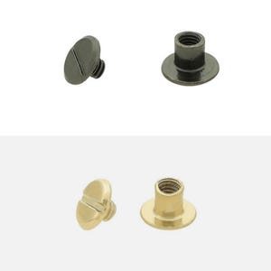 May include: Two sets of metal Chicago screws, one in a dark gunmetal finish and one in a polished gold finish. Each set consists of a flat-headed screw with a slotted top and a corresponding threaded cylindrical post with a wide circular base.