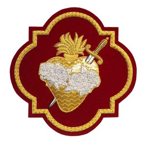 May include: Embroidered patch featuring a heart pierced by a sword, with a gold flame and white roses. The heart is gold, with white roses, and the patch is on a red background with a gold border.