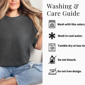 May include: A charcoal gray t-shirt with a crew neck. The image includes a washing and care guide with instructions: wash with like colors, wash in cool water, tumble dry at low-temp, do not bleach, and do not iron design.
