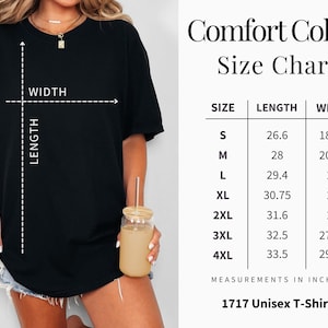 May include: A black Comfort Colors 1717 Unisex T-shirt with a size chart. The chart shows measurements in inches, with sizes ranging from S to 4XL. The length of the shirt ranges from 26.6 to 33.5 inches, and the width ranges from 18.25 to 29.75 inches.