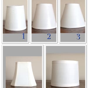 May include: Five white lampshades of different shapes and sizes. The lampshades are all made of a fabric material.