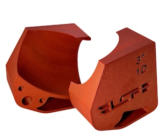 May include: Two orange-colored 3D printed pipe clamps. The clamp on the right has the text "3" and "1D" printed on it. The clamp on the left has a hole in the side. Both clamps are made by "SLCF".