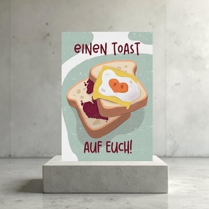 Postkarte „Einen Toast auf euch!“ – Humorvoll, süß & perfekt zum Anstoßen