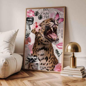 May include: Framed art print featuring a collage with a leopard, pink lips, disco balls, and a butterfly. The leopard has a flower in its hair and the text "Lucky Girl" is visible. The artwork has a vintage aesthetic.
