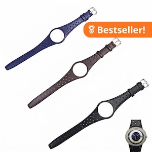 May include: Three watch straps in blue, brown, and black, each featuring a textured surface, a circular cutout for a watch face, and a silver-tone metal buckle. A small inset image shows a watch with a blue face and silver hands attached to a strap.