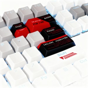 May include: A close-up of a mechanical keyboard with white and grey keycaps. Several keycaps are black and red, with the text "LECLERC RADIO" and other text. The "Shift" key has a red arrow design.