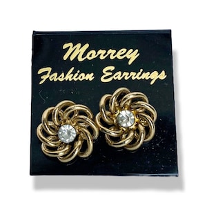 Gold knot stud earrings with rhinestone center