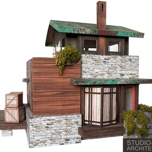 K&ouml;nnte beinhalten: Ein Modell eines kleinen, rustikalen Hauses mit einem gr&uuml;nen Dach, Steinmauern und Holzverkleidung. Das Haus hat eine kleine Veranda mit einem Holzgel&auml;nder und ein paar Holzkisten auf der Veranda. Das Haus ist aus Papier und Teil eines Papiermodellbausatzes.