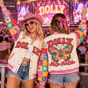 May include: A cream-colored varsity jacket with pink striped trim and multicolored patchwork sleeves featuring floral and paisley patterns. The back displays a large butterfly graphic with the text DOLLY and A Life in Full Color.