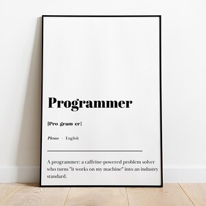 May include: Black and white typography poster with the word "Programmer" defined as "a caffeine-powered problem solver who turns 'it works on my machine' into an industry standard."