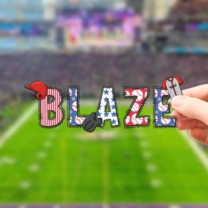 May include: The word "BLAZE" in a baseball theme, with each letter decorated with baseball-related designs. The "B" has red and white stripes, the "L" has blue stars, the "A" has baseballs, the "Z" has baseballs, and the "E" has blue stars. A red baseball helmet, a baseball glove, and a baseball jersey are also included.