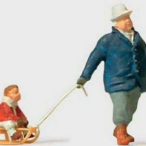 Preiser 28078 HO Scale Individual Figures Man Pulling Child on Sled