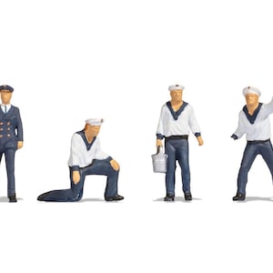 May include: A set of six miniature sailor figurines in various poses. Some wear white shirts with dark blue collars and dark blue trousers, while others wear dark blue double-breasted jackets and trousers. All figures wear matching sailor caps.