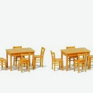 May include: Two sets of miniature wooden furniture, each consisting of a rectangular table and four chairs. The furniture is crafted from light-toned wood with a smooth finish, featuring simple, clean lines and a classic four-legged table design.