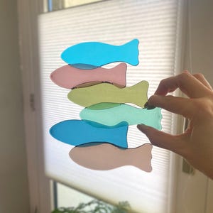 Glass fused fish sculpture in soft tone colors