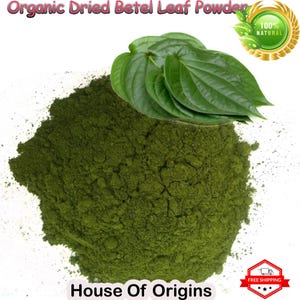 May include: A pile of green betel leaf powder with fresh betel leaves on top. The powder is labeled "Organic Dried Betel Leaf Powder" and "House of Origins". A gold seal with the text "100% NATURAL" is in the upper right corner.