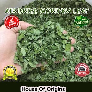 May include: A close-up of air-dried moringa leaves, a vibrant green, held in a hand. The image includes text that reads "Air Dried Moringa Leaf", "100% Natural", and "House of Origins". There are also several circular badges with text.