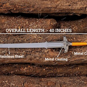 May include: A stainless steel sword with metal casting and an overall length of 40 inches. The handle is orange and the blade is silver. The sword is displayed on a wooden surface.