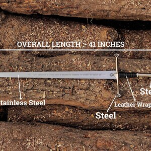 May include: A stainless steel sword with an overall length of 41 inches. The blade is silver, with steel accents on the hilt and a leather-wrapped handle. The sword is displayed on a background of wooden logs.