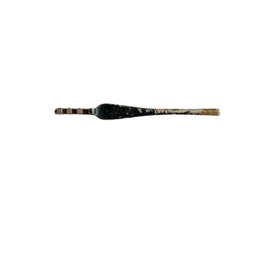 May include: A vintage metal crochet hook with a dark, worn finish and visible paint chipping. The tool features a flat, textured handle area and a distinct hook end. The metal shows signs of age with a metallic, silver-toned tip and a dark, weathered body.