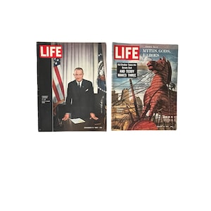 May include: Two vintage LIFE magazines. The first features a portrait of a man in a suit with the American flag in the background. The second magazine cover displays a Trojan horse illustration with the text "MYTHS, GODS, HEROES".
