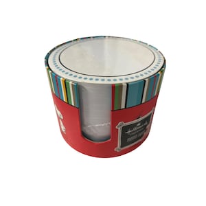 May include: A red Hallmark memo card holder with a Snoopy graphic. The cylindrical container has a striped pattern in shades of blue, green, yellow, and white. The top is white with a blue dotted border.