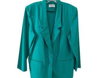 May include: Teal blazer with a notched collar, two front pockets, and two-button closure. The blazer is hanging on a clear hanger. The label reads "Alfred Dunner".