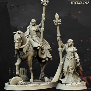 May include: Two miniature figures, one on horseback and one standing, both holding ornate staffs. The figures are dressed in flowing robes and have a medieval fantasy theme. The logo "highlands miniatures" is in the upper right corner.
