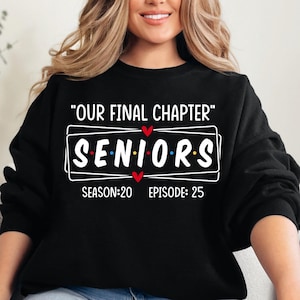 May include: Black sweatshirt with white text that reads "Our Final Chapter" and "Seniors" with hearts. The text "Season: 20 Episode: 25" is below the word "Seniors".