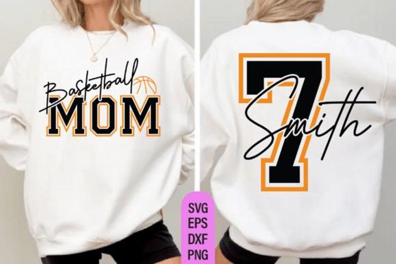 May include: White sweatshirt with the text "Basketball MOM" in black and orange lettering on the front. The back features the number 7 in black with an orange outline and the name "Smith" in script.
