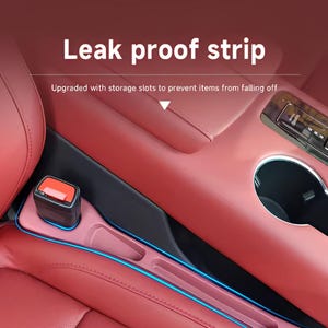 May include: A red car interior with a pink leak-proof strip installed. The strip has a blue neon trim and storage slots. The text "Leak proof strip" is displayed above the car seat.