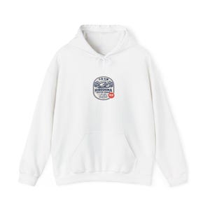 May include: A white hooded sweatshirt with a front pocket and a drawstring. The sweatshirt features a circular graphic on the chest with the text "Hiroshima Oyster House" in blue and red.